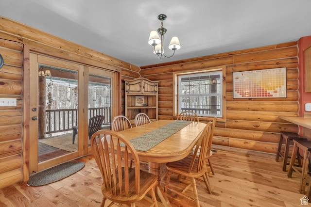 4125 S Buck Way Unit 1958, Heber City, UT 84032 - dining room with light hardwood / wood-style flooring, log walls, and a chandelier