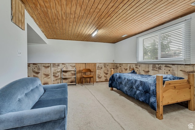 bedroom featuring wood ceiling and wooden walls