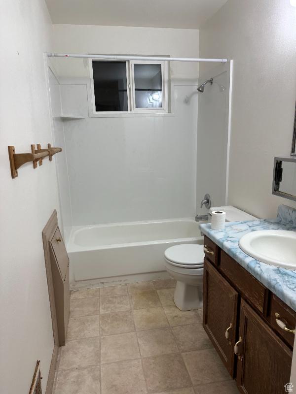 full bathroom with shower / washtub combination, vanity, and toilet
