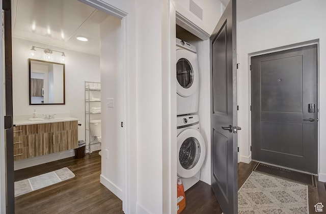 6495 Serviceberry Dr Unit B205, Park City, UT 84098 - laundry room with dark hardwood / wood-style floors, stacked washer / dryer, and sink