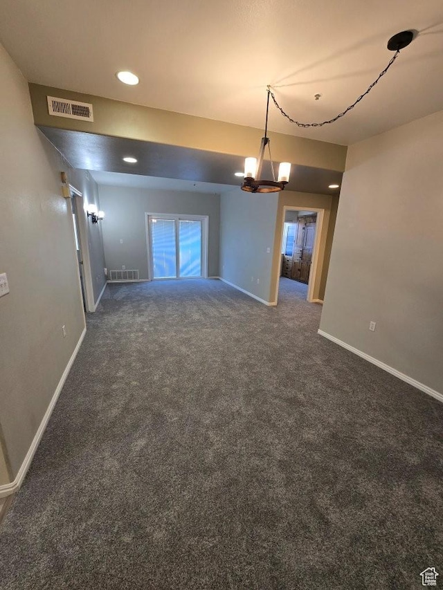 11075 S Grape Arbor Pl E Unit 103, Sandy, UT 84070 - carpeted spare room with baseboards, visible vents, and a notable chandelier