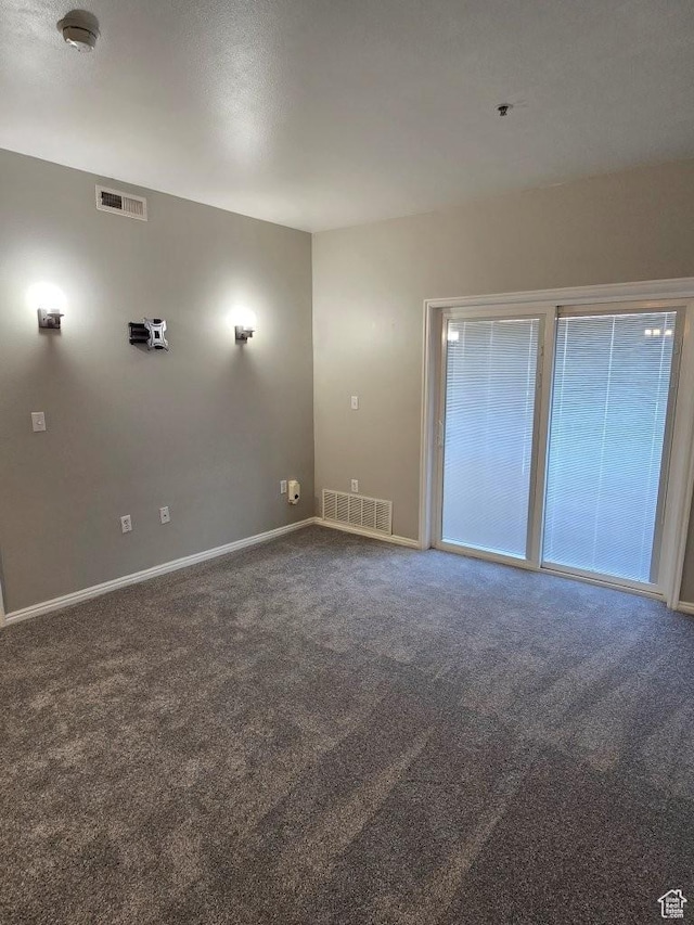 11075 S Grape Arbor Pl E Unit 103, Sandy, UT 84070 - carpeted spare room with baseboards and visible vents