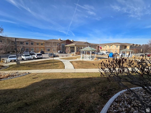 11075 S Grape Arbor Pl E Unit 103, Sandy, UT 84070 - view of property's community featuring a gazebo, a yard, uncovered parking, and a residential view