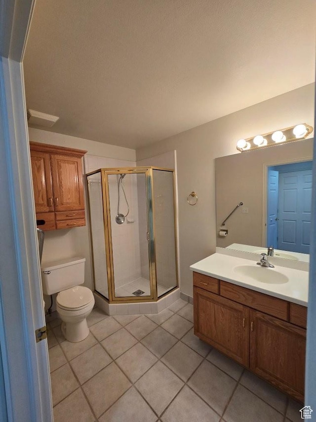 11075 S Grape Arbor Pl E Unit 103, Sandy, UT 84070 - bathroom with toilet, vanity, a shower stall, and tile patterned flooring