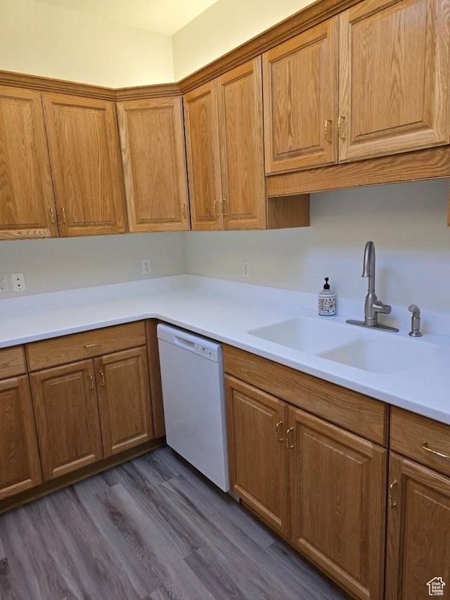 11075 S Grape Arbor Pl E Unit 103, Sandy, UT 84070 - kitchen with brown cabinetry, white dishwasher, and a sink