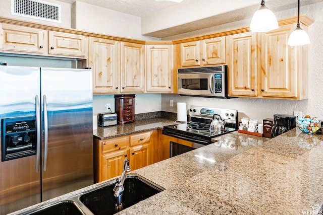 2653 Canyon Resort Dr Unit 227, Park City, UT 84098 - kitchen with light stone countertops, sink, hanging light fixtures, and appliances with stainless steel finishes