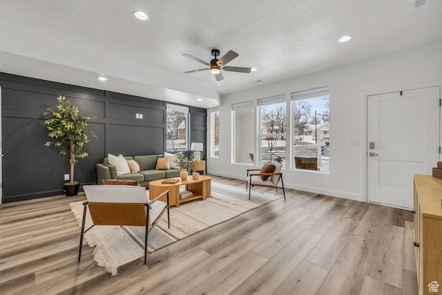 233 E Burch Creek Pl S, Ogden, UT 84405 - living area featuring a decorative wall, recessed lighting, a ceiling fan, and light wood-type flooring