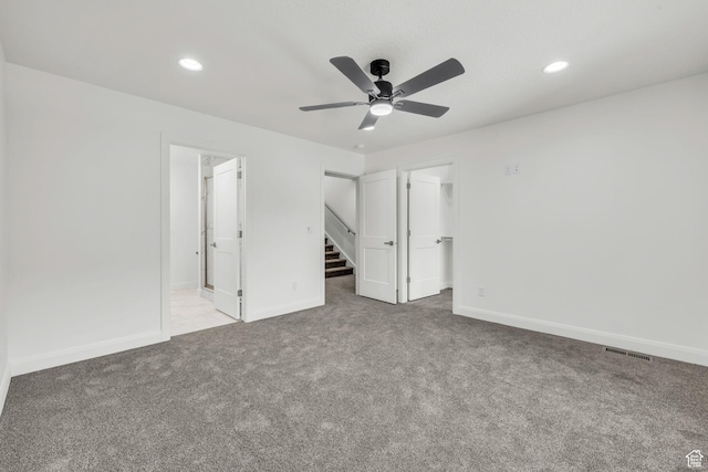 233 E Burch Creek Pl S, Ogden, UT 84405 - unfurnished bedroom featuring a spacious closet, baseboards, visible vents, and carpet floors