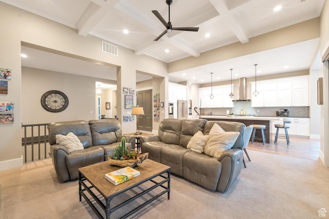 living room featuring coffered ceiling, beamed ceiling, a ceiling fan, and visible vents