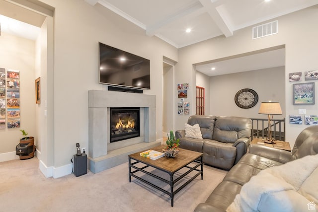 living area with visible vents, baseboards, a high end fireplace, beam ceiling, and carpet flooring