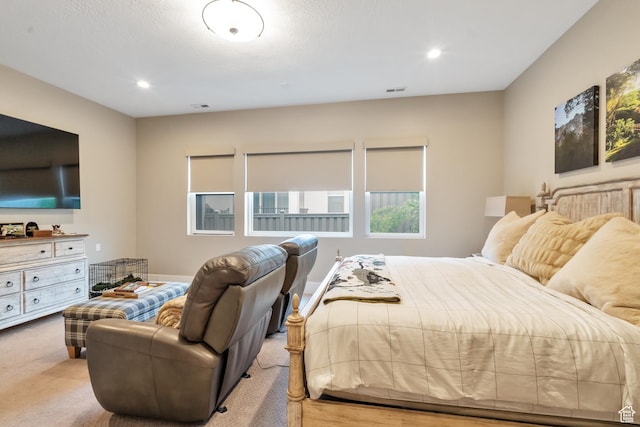 carpeted bedroom featuring recessed lighting