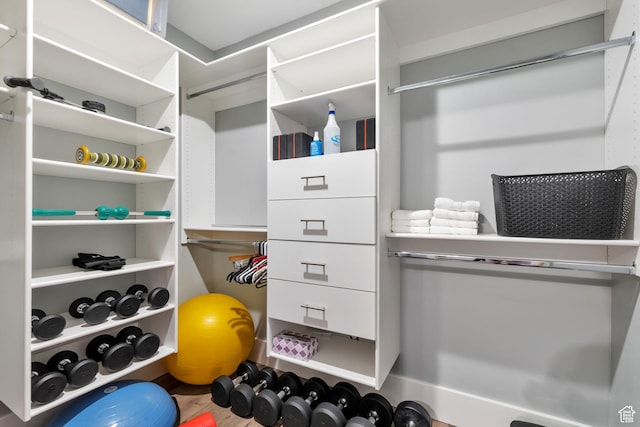 spacious closet with wood finished floors