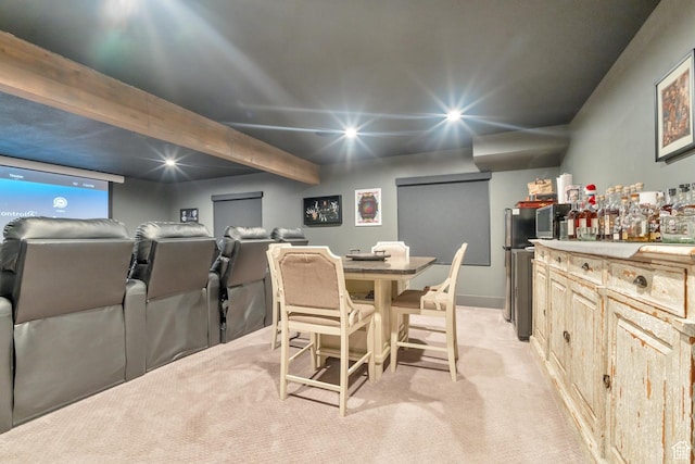 dining space with a dry bar, recessed lighting, and light colored carpet