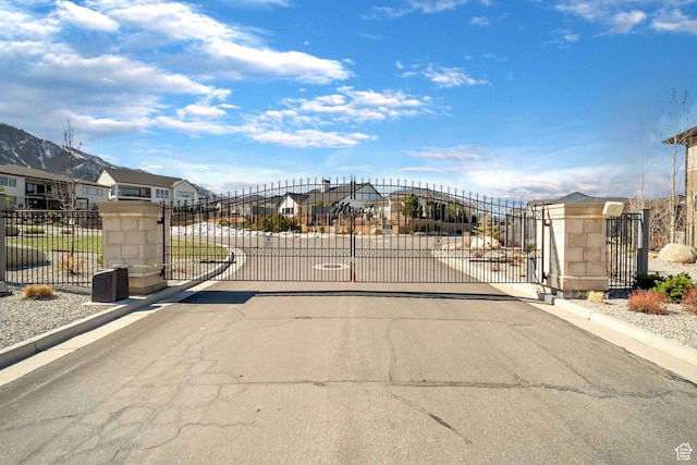 view of gate featuring a residential view