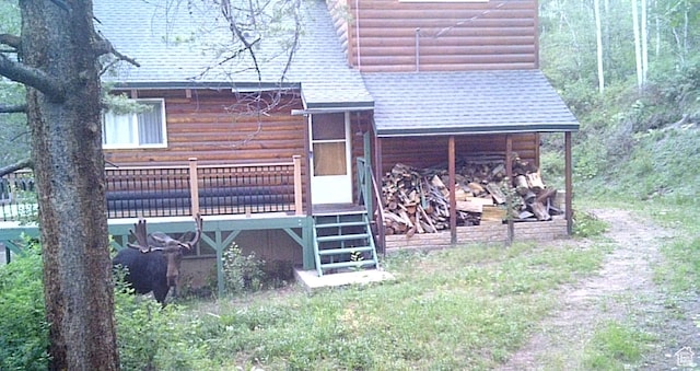 51 Aspen Loop 51&52, Oakley, UT 84055 - rear view of property with log veneer siding, a shingled roof, and a deck