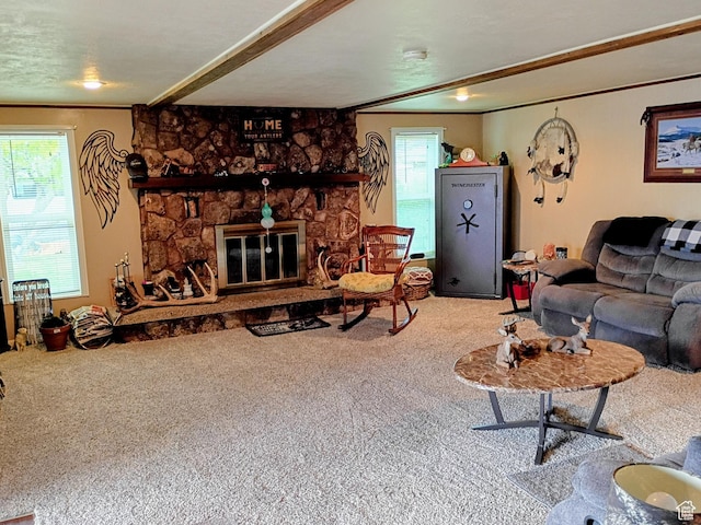 living room with a fireplace, crown molding, and carpet