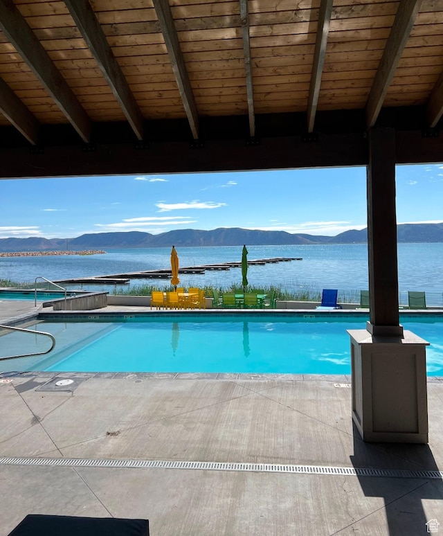 585 N Amber Ln, Garden City, UT 84028 - view of pool with a patio and a water and mountain view