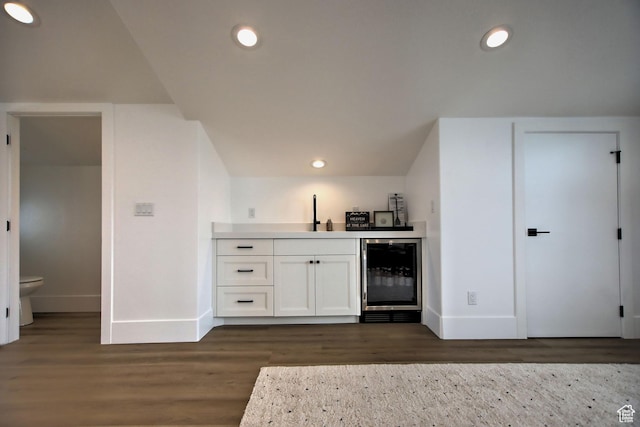 585 N Amber Ln, Garden City, UT 84028 - bar featuring dark wood-type flooring, white cabinetry, sink, and beverage cooler