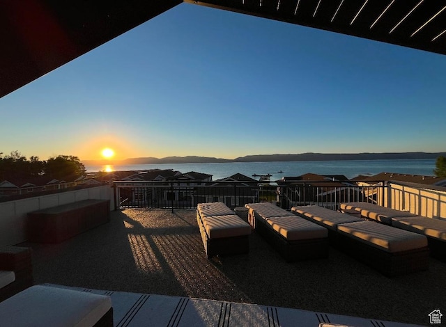 585 N Amber Ln, Garden City, UT 84028 - deck at dusk featuring a water view