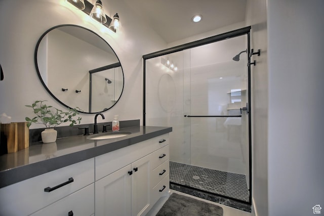 585 N Amber Ln, Garden City, UT 84028 - bathroom featuring a shower with door and vanity