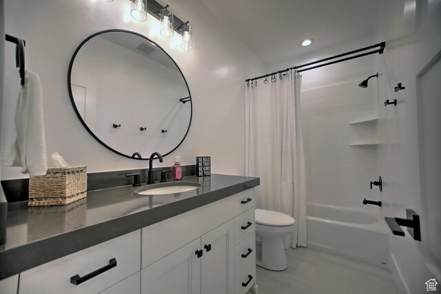 585 N Amber Ln, Garden City, UT 84028 - full bathroom with vanity, toilet, and shower / bathtub combination with curtain