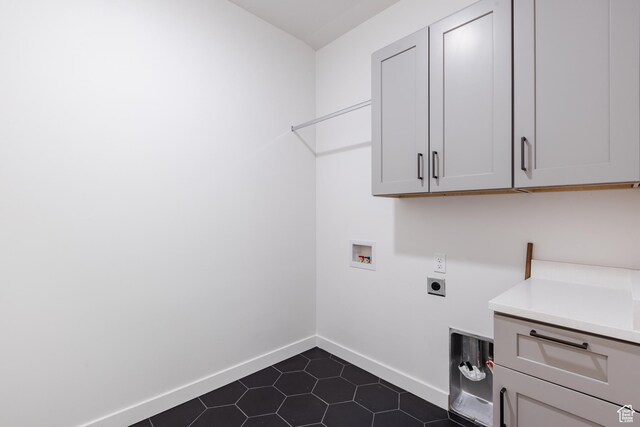 3305 W 2610 S, Hurricane, UT 84737 - laundry room with cabinet space, dark tile patterned floors, electric dryer hookup, baseboards, and hookup for a washing machine