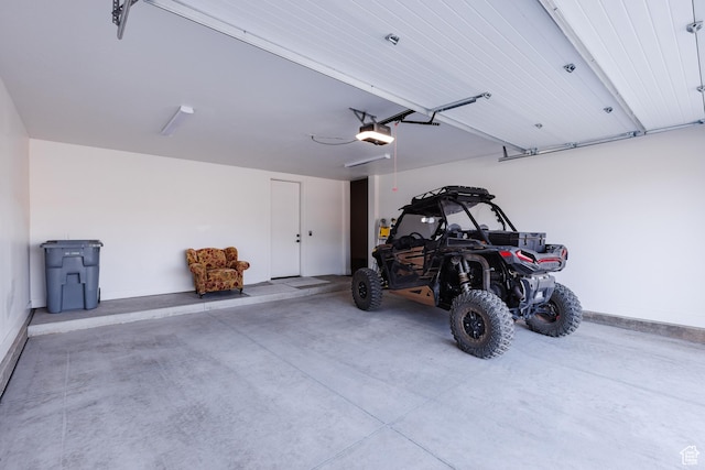 3305 W 2610 S, Hurricane, UT 84737 - garage featuring baseboards and a garage door opener