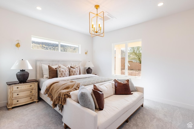 3305 W 2610 S, Hurricane, UT 84737 - bedroom with multiple windows, an inviting chandelier, recessed lighting, and light colored carpet