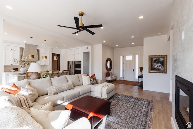 3305 W 2610 S, Hurricane, UT 84737 - living room with recessed lighting, baseboards, ceiling fan, wood finished floors, and a large fireplace