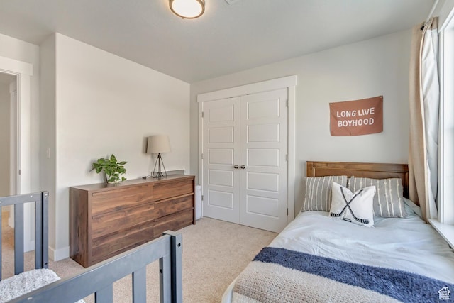 carpeted bedroom featuring a closet