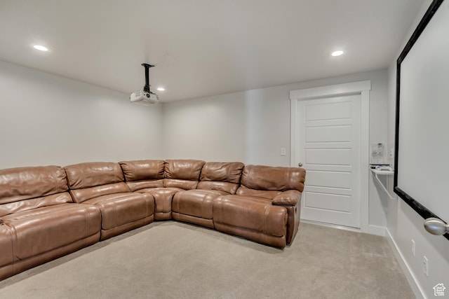 living area with recessed lighting and light colored carpet