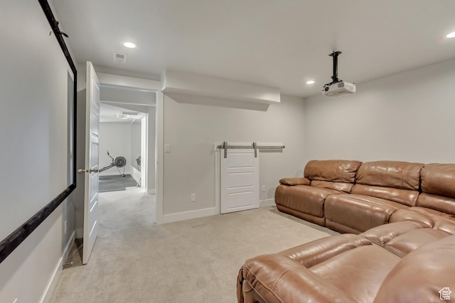 living room with baseboards, light carpet, recessed lighting, and a barn door