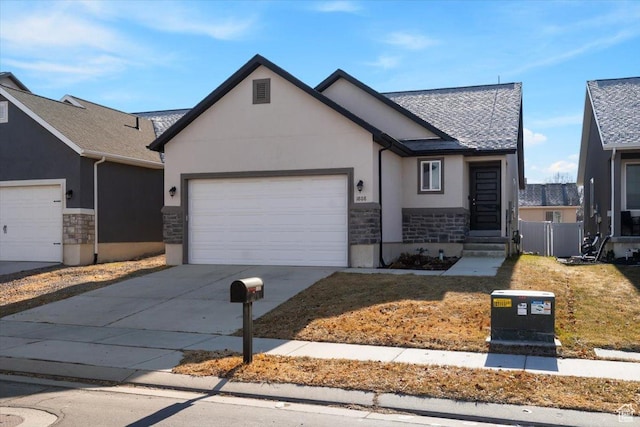 view of front facade featuring a garage and a front lawn