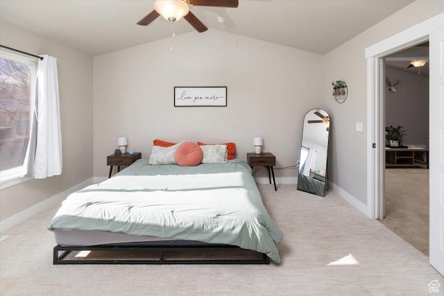 bedroom with light carpet, vaulted ceiling, and ceiling fan