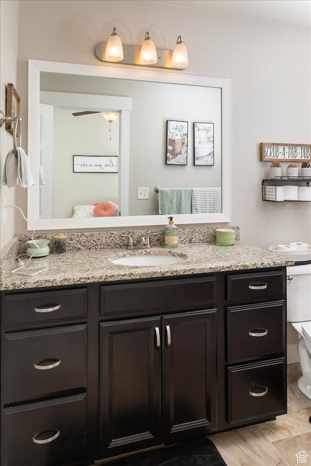 bathroom featuring vanity and ceiling fan