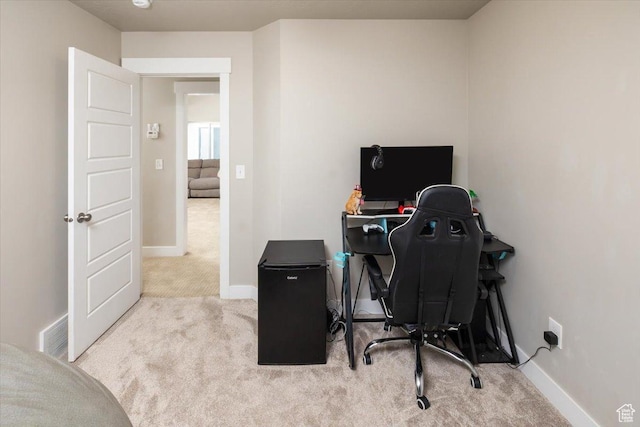 office area with light colored carpet