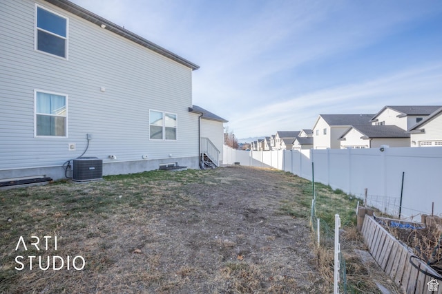 back of property with central AC unit