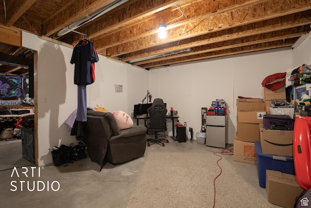 basement featuring white refrigerator