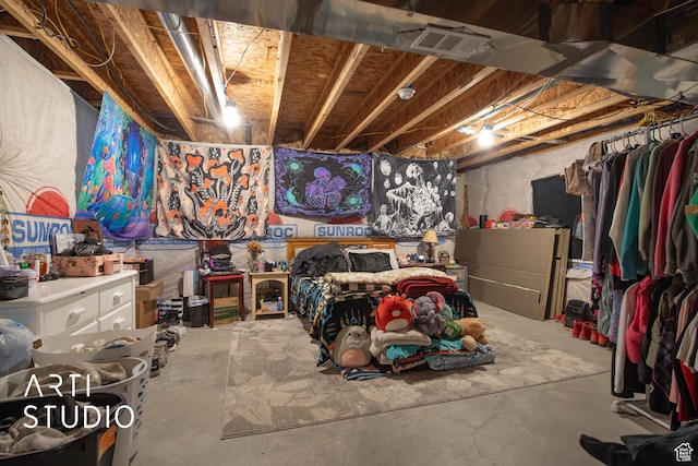 bedroom featuring concrete floors