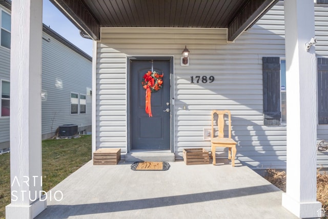 property entrance with central AC unit