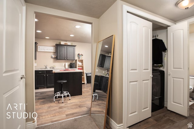 bathroom with hardwood / wood-style floors, vanity, and toilet