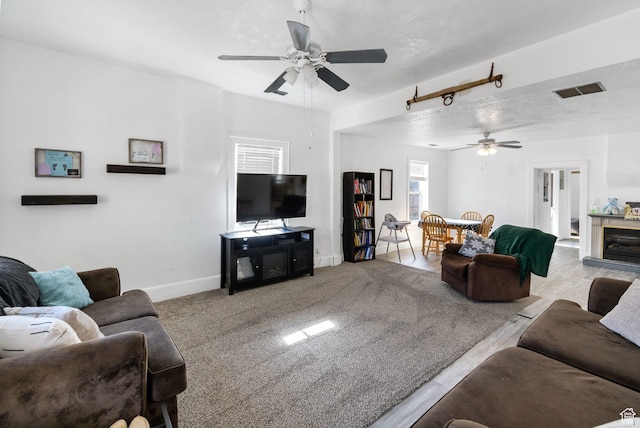60 S 100 W, Monroe, UT 84754 - living room with light carpet, a textured ceiling, and ceiling fan