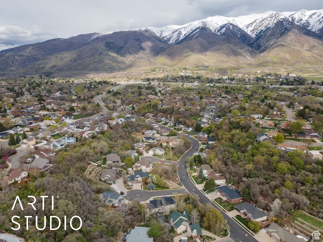 birds eye view of property with a residential view and a mountain view