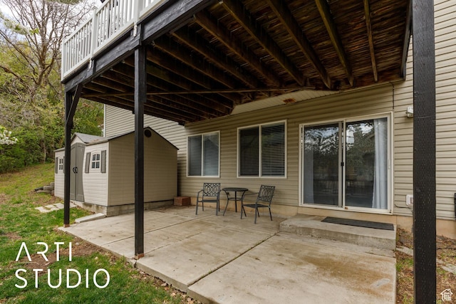 view of patio featuring a storage unit and an outdoor structure