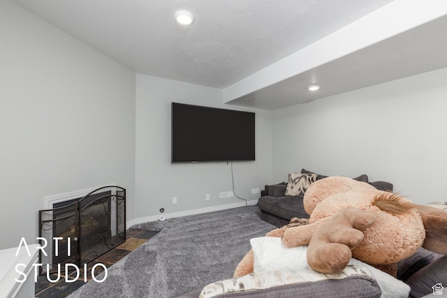 carpeted living room featuring a fireplace with flush hearth, baseboards, and recessed lighting