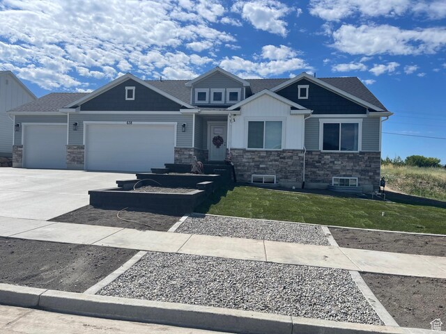 638 E Canyon Rim Rd N, Smithfield, UT 84335 - craftsman inspired home featuring a garage and a front lawn