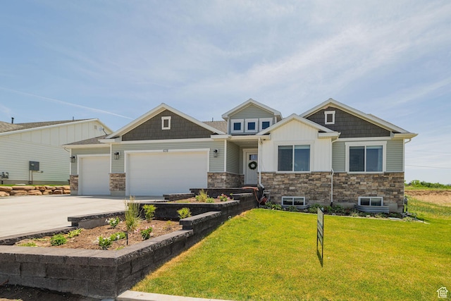 638 E Canyon Rim Rd N, Smithfield, UT 84335 - craftsman-style house featuring an attached garage, stone siding, a front lawn, driveway, and board and batten siding