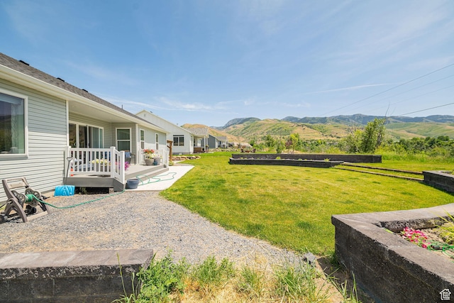 638 E Canyon Rim Rd N, Smithfield, UT 84335 - view of grassy yard featuring a deck with mountain view