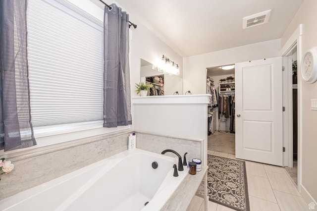 638 E Canyon Rim Rd N, Smithfield, UT 84335 - bathroom featuring tile patterned flooring and a relaxing tiled tub