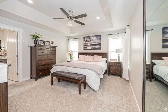 638 E Canyon Rim Rd N, Smithfield, UT 84335 - bedroom with a tray ceiling, ceiling fan, and light colored carpet
